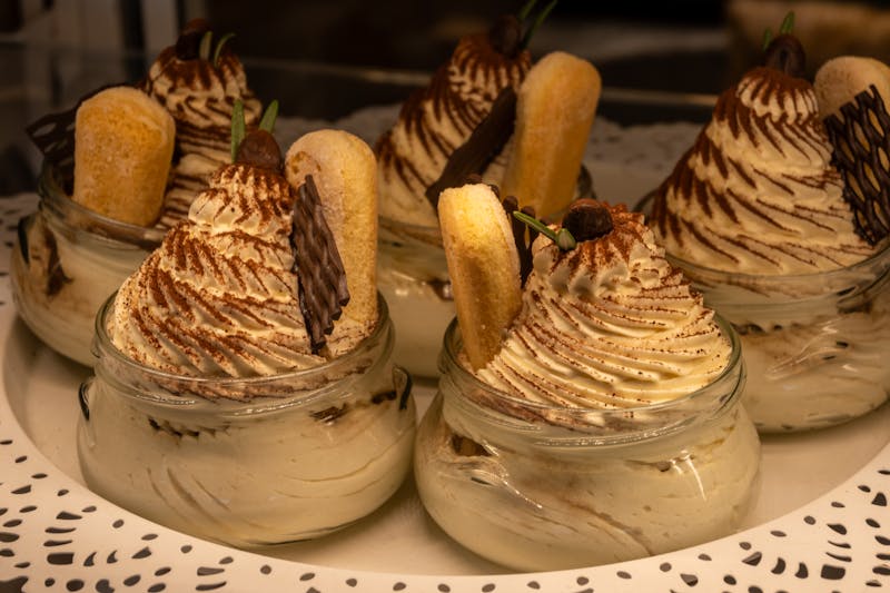 Classic Italian tiramisu dessert with cocoa dusting